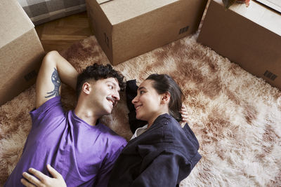 Young couple lying down together