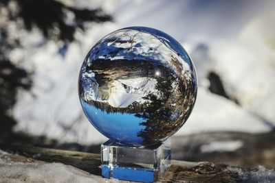 Close-up of crystal ball on rock