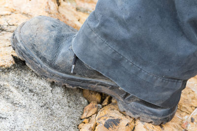 Low section of man standing on ground