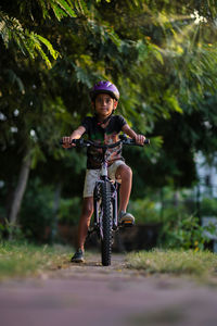 Boy riding bicycle