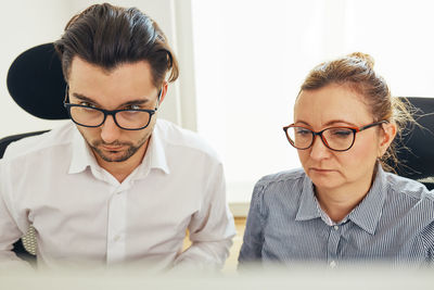 Business people working at computer screen together. teamwork and co-working in office. workmates