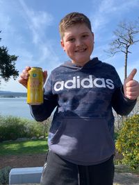 Portrait of smiling boy standing outdoors