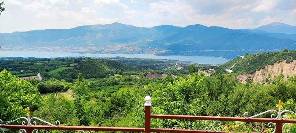 Scenic view of landscape and mountains against sky