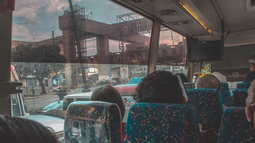 Rear view of people in bus