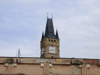 Low angle view of clock tower against sky