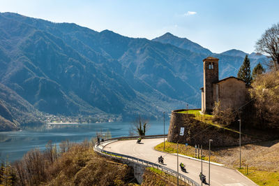 Panoramic view of road leading towards lake