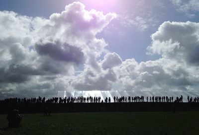 People on field against sky