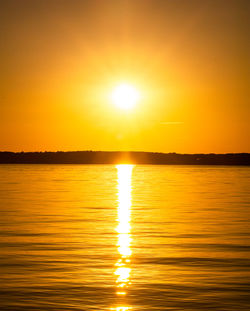 Scenic view of sea against romantic sky at sunset