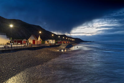 Scenic view of sea against sky at night