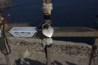 High angle view of rope tied to bollard