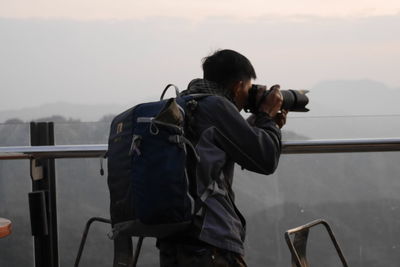 Man photographing with camera