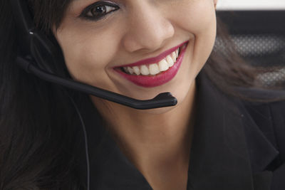 Close-up portrait of a smiling young woman