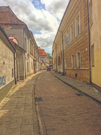 Empty alley amidst buildings in town