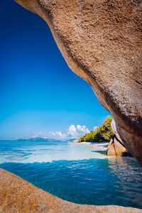 Scenic view of sea against blue sky