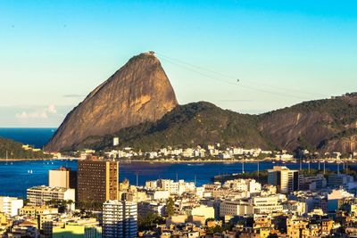 View of cityscape and sugarloaf mountain against sky