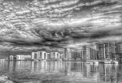 City skyline against cloudy sky