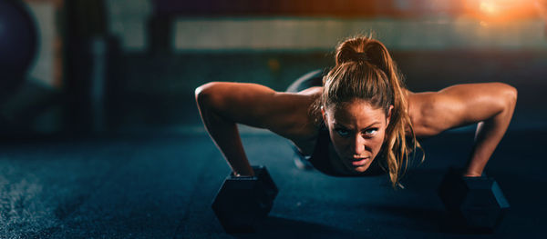Portrait of woman exercising at gym 
