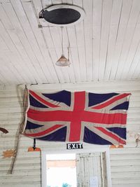 Low angle view of flag against building