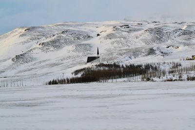 Scenic view of landscape against sky during winter