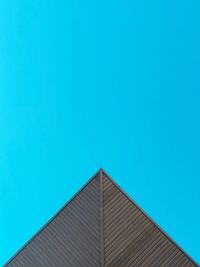 Low angle view of building against blue sky