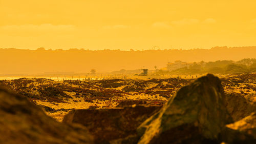 Scenic view of landscape against sky during sunset