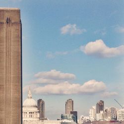 Low angle view of building against cloudy sky