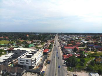 High angle view of road amidst buildings in city