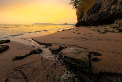 Sunset at phra nang beach, krabi province, thailand.