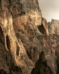 Low angle view of rock formation against sky
