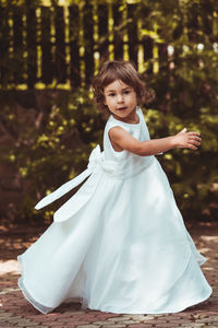 Portrait of cute girl standing outdoors