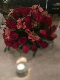 Close-up of red roses on table