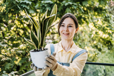 Portrait of young woman using mobile phone