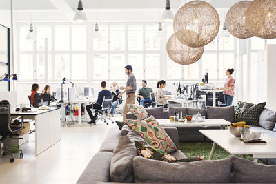 Modern office lobby with business people working in background