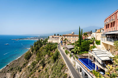 Hotel building in taormina with accommodation for tourists on a hill