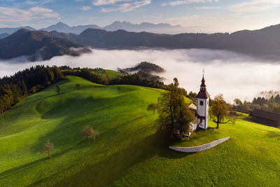 Scenic view of landscape and mountains against sky