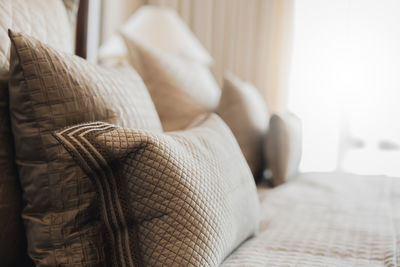 Close-up of sofa relaxing on bed at home