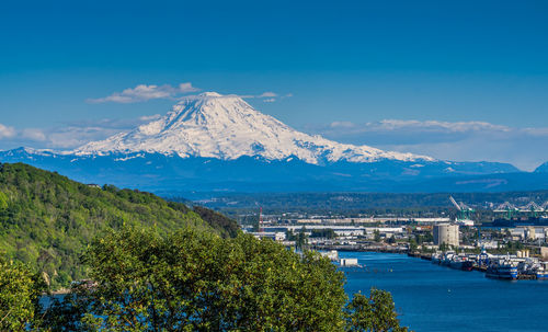 Scenic view of mount rainier and the port of tacoma.