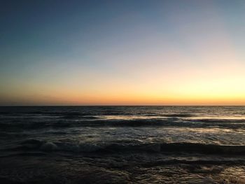 Scenic view of sea against clear sky during sunset