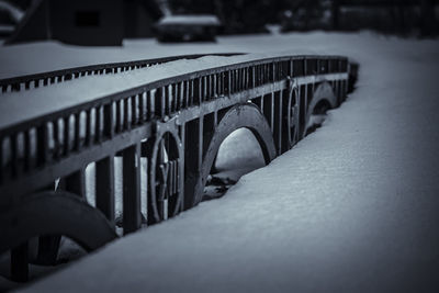 Close-up of snow on metal grate