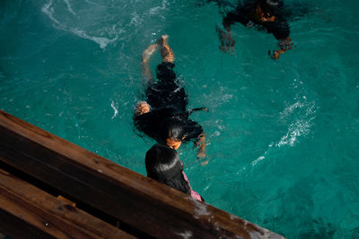 High angle view of man swimming in sea