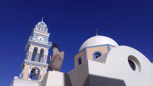 Low angle view of church against blue sky