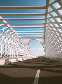 Low angle view of modern bridge against sky