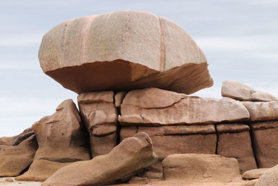 Bizarre boulders and rocks on the pink granite coast on the island of renote