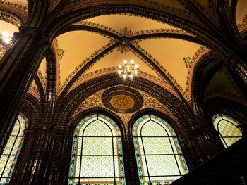 Low angle view of illuminated ceiling of building