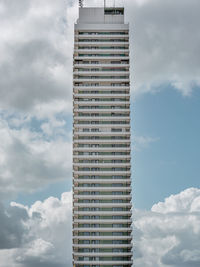 Low angle view of building against cloudy sky