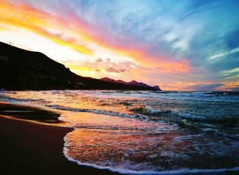 Scenic view of sea against cloudy sky