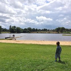 Man standing on grassy field in park