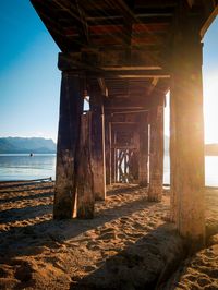 View of abandoned pier on beach