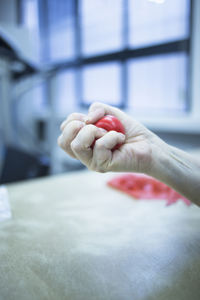 Cropped hand squeezing stress ball