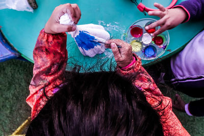 High angle view of girl hands